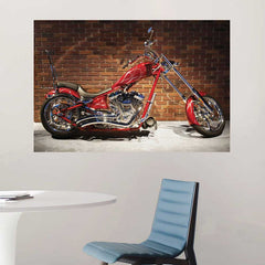 48 inch Red chopper motorcycle against a brick wall installed on a white wall with a blue chair and white table below.
