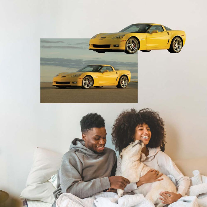 36 inch Yellow Corvette Z06 wall decal installed on wall above people in bed