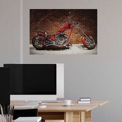 36 inch Red custom flame motorcycle against a brick wall installed in a modern office desk in the foreground