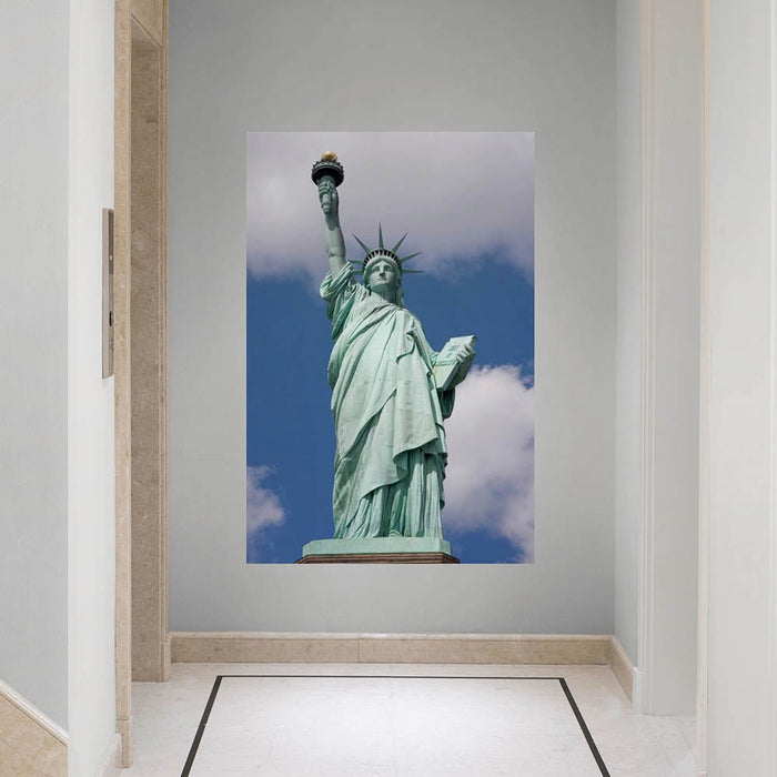 48x72 inch Statue of Liberty Against Blue Sky Poster Installed in Entrance